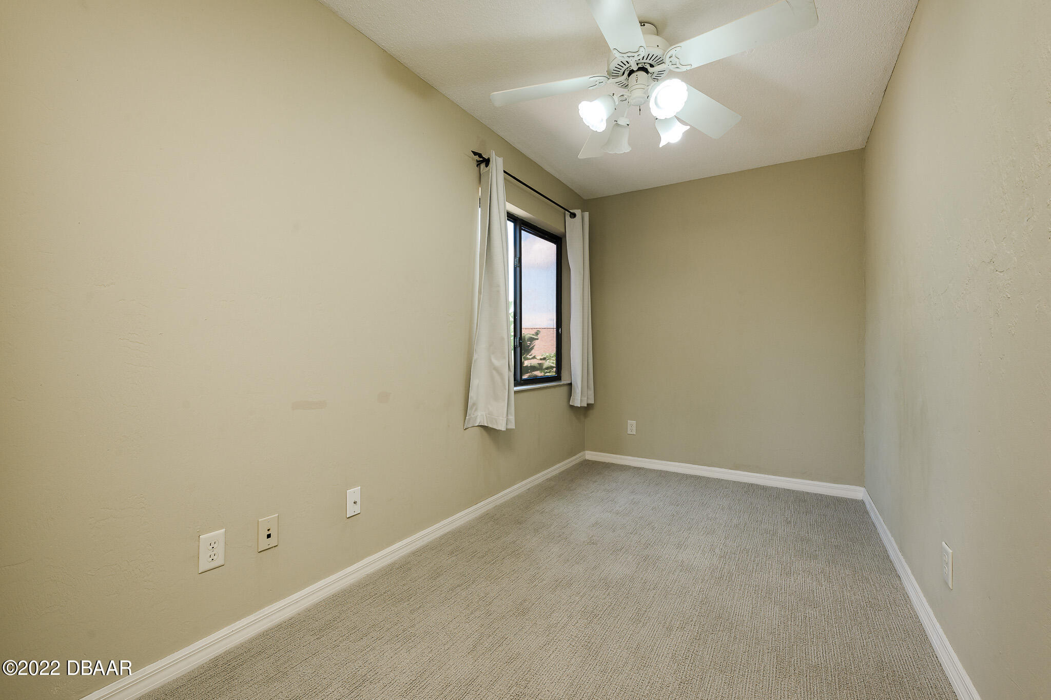 35 Pebble Beach Drive Ormond Beach, FL 32174 - Photo 29 of 45 an empty room with a window and a fan