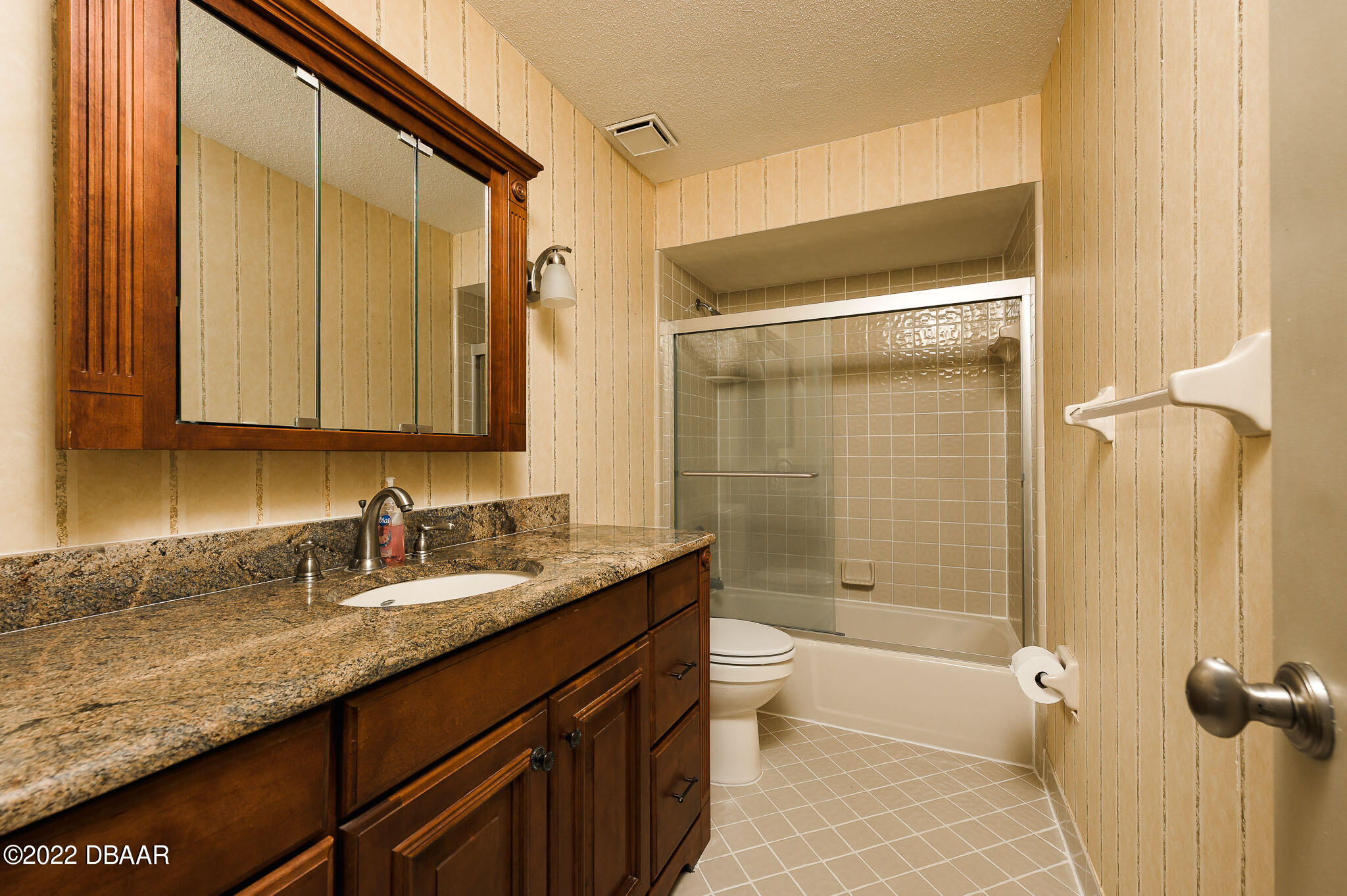 35 Pebble Beach Drive Ormond Beach, FL 32174 - Photo 30 of 45 a bathroom with a granite countertop sink toilet and shower