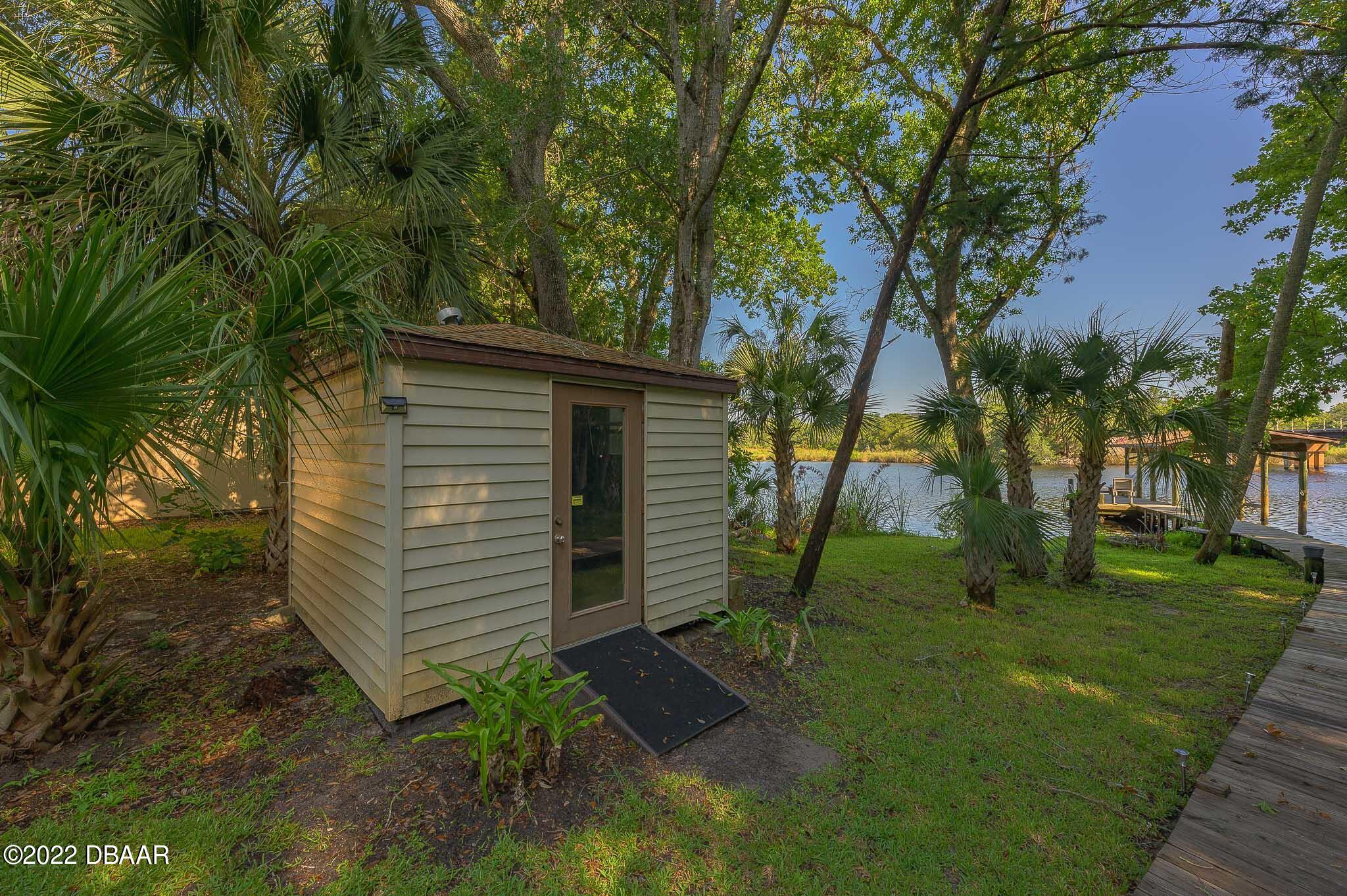 35 Pebble Beach Drive Ormond Beach, FL 32174 - Photo 35 of 45 a view of a back yard of the house