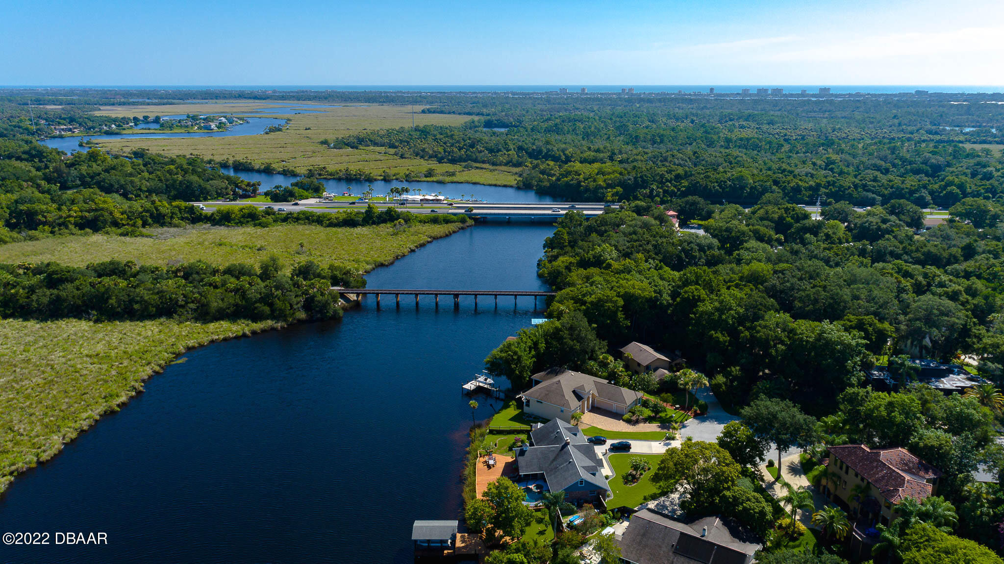 35 Pebble Beach Drive Ormond Beach, FL 32174 - Photo 39 of 45 an aerial view of lake and residential houses with outdoor space
