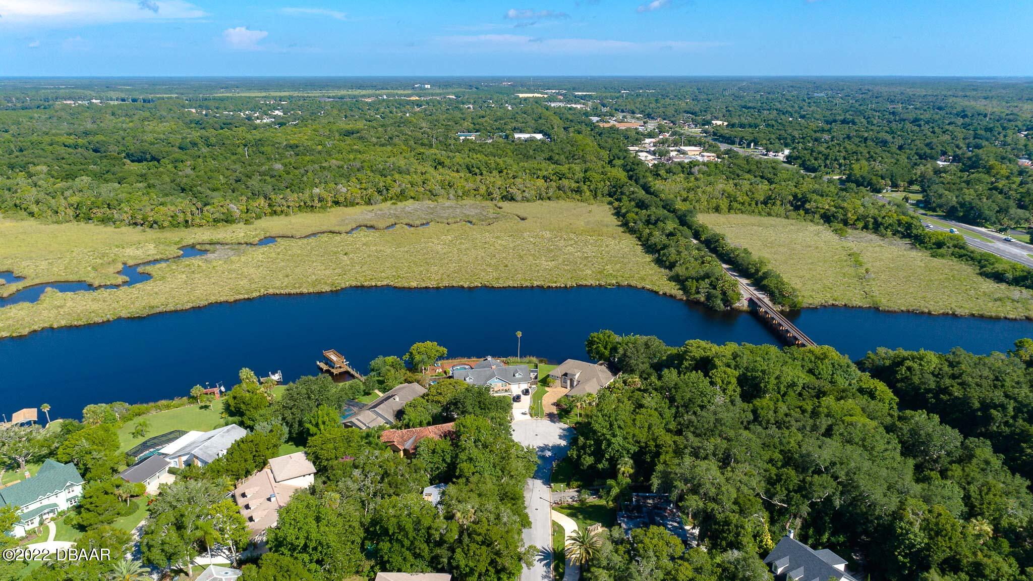 35 Pebble Beach Drive Ormond Beach, FL 32174 - Photo 41 of 45 an aerial view of a houses with a yard
