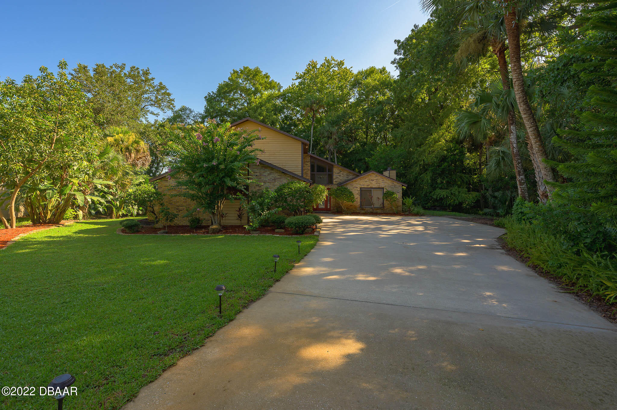 35 Pebble Beach Drive Ormond Beach, FL 32174 - Photo 45 of 45 a view of a street with a tree