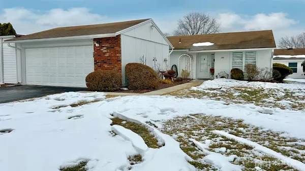 a view of a house with snow on the ground