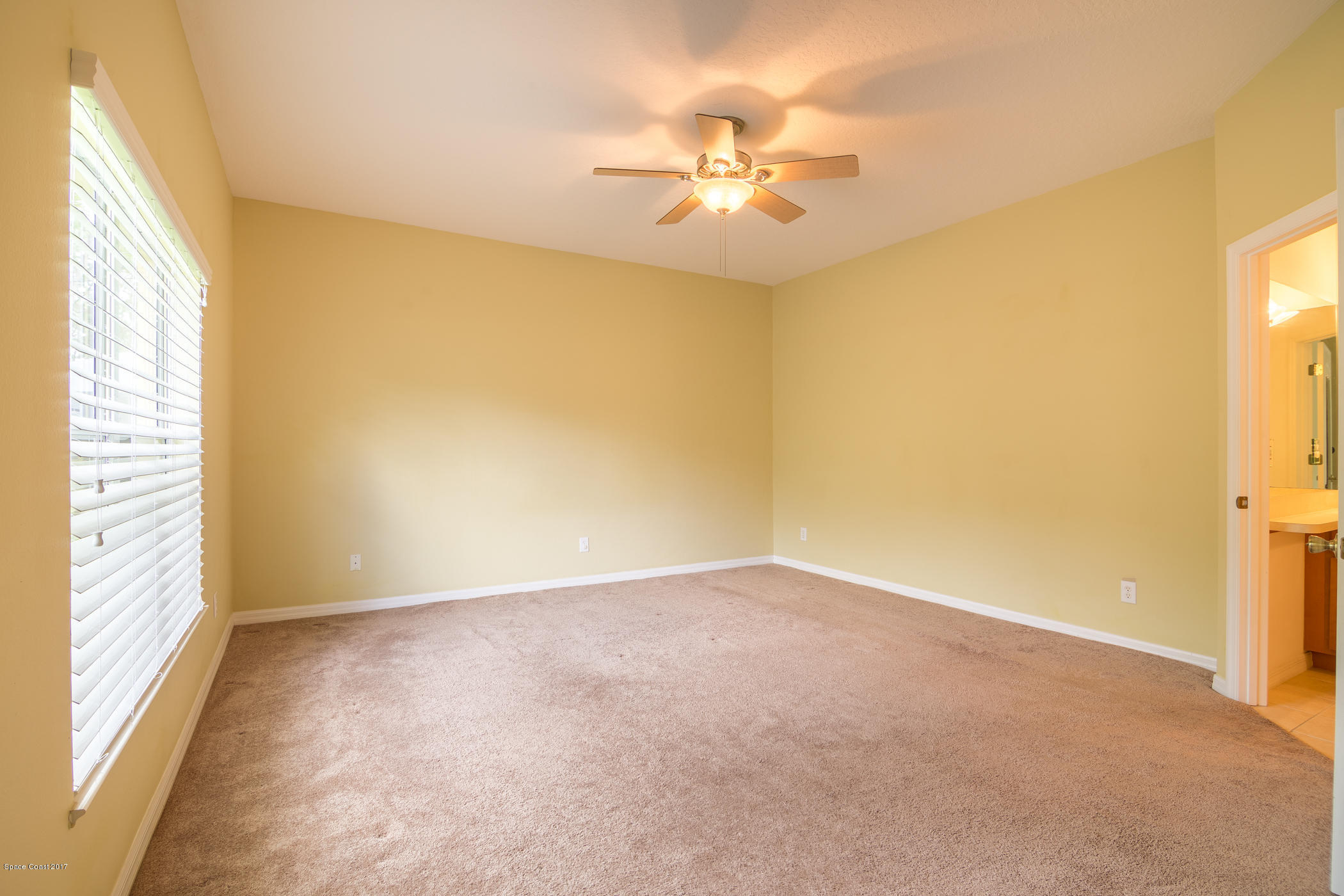 1875 Dragon Road Southeast Palm Bay, FL 32909 - Photo 11 of 18 Master Bedroom with Walk In Closet