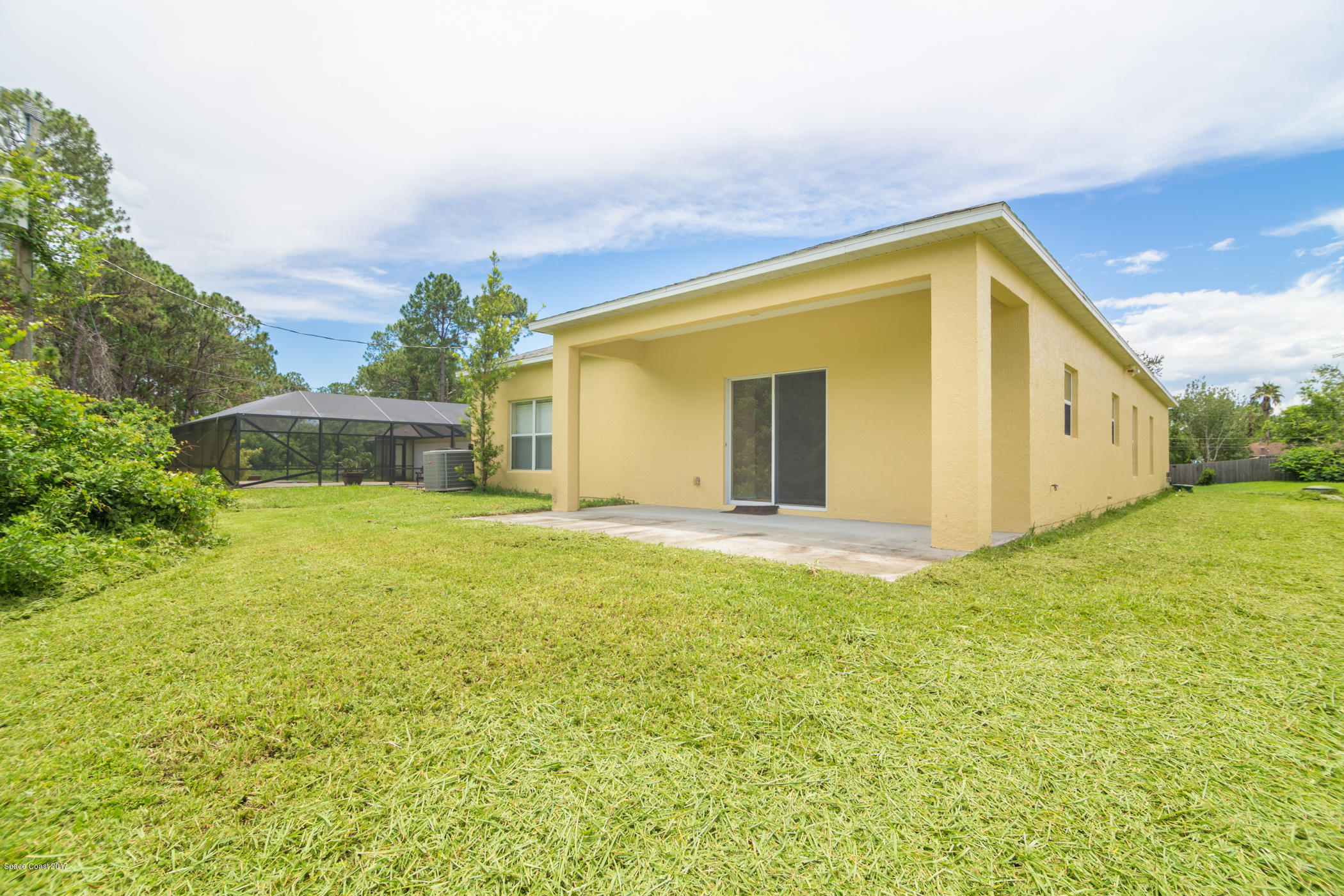 1875 Dragon Road Southeast Palm Bay, FL 32909 - Photo 18 of 18 Covered Patio in Open Backyard