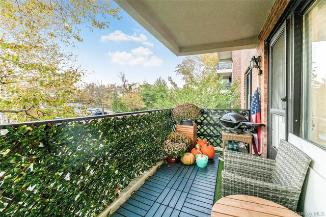 a view of a balcony with wooden floor