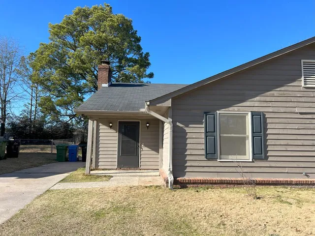 a house with trees in the background