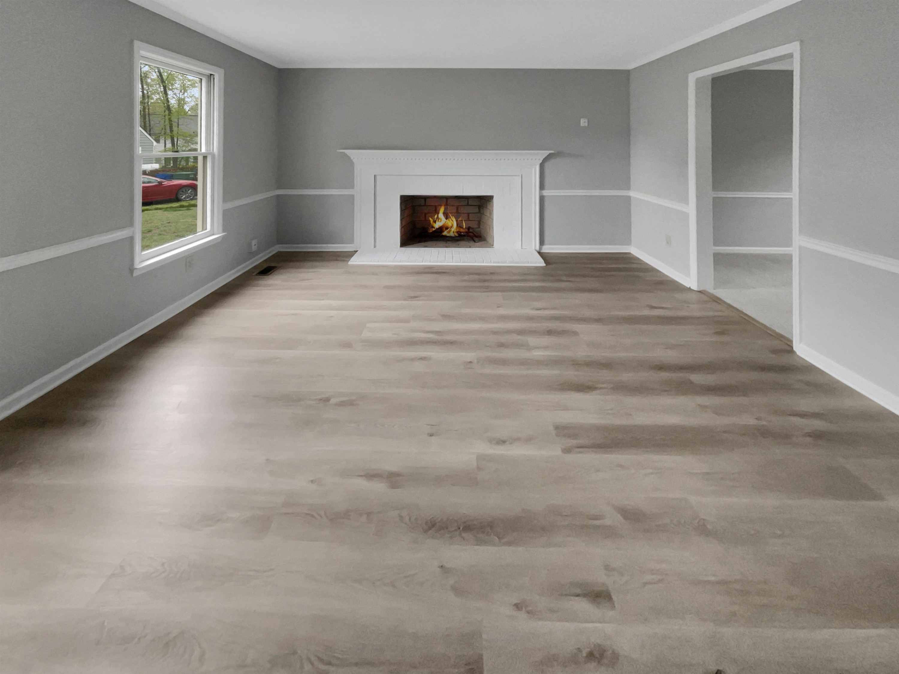 7320 Ewing Place Raleigh, NC 27616 - Photo 3 of 19 a view of an empty room with a window and fireplace