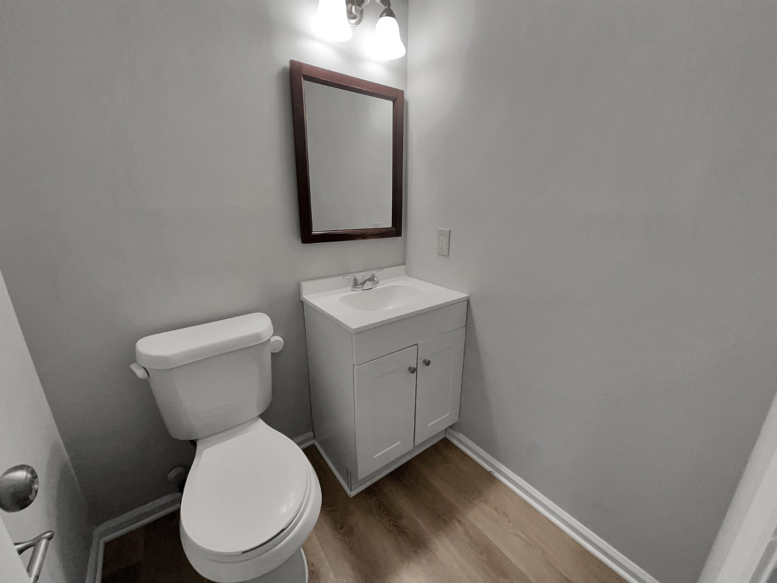 7320 Ewing Place Raleigh, NC 27616 - Photo 6 of 19 a white toilet sitting next to a bathroom sink
