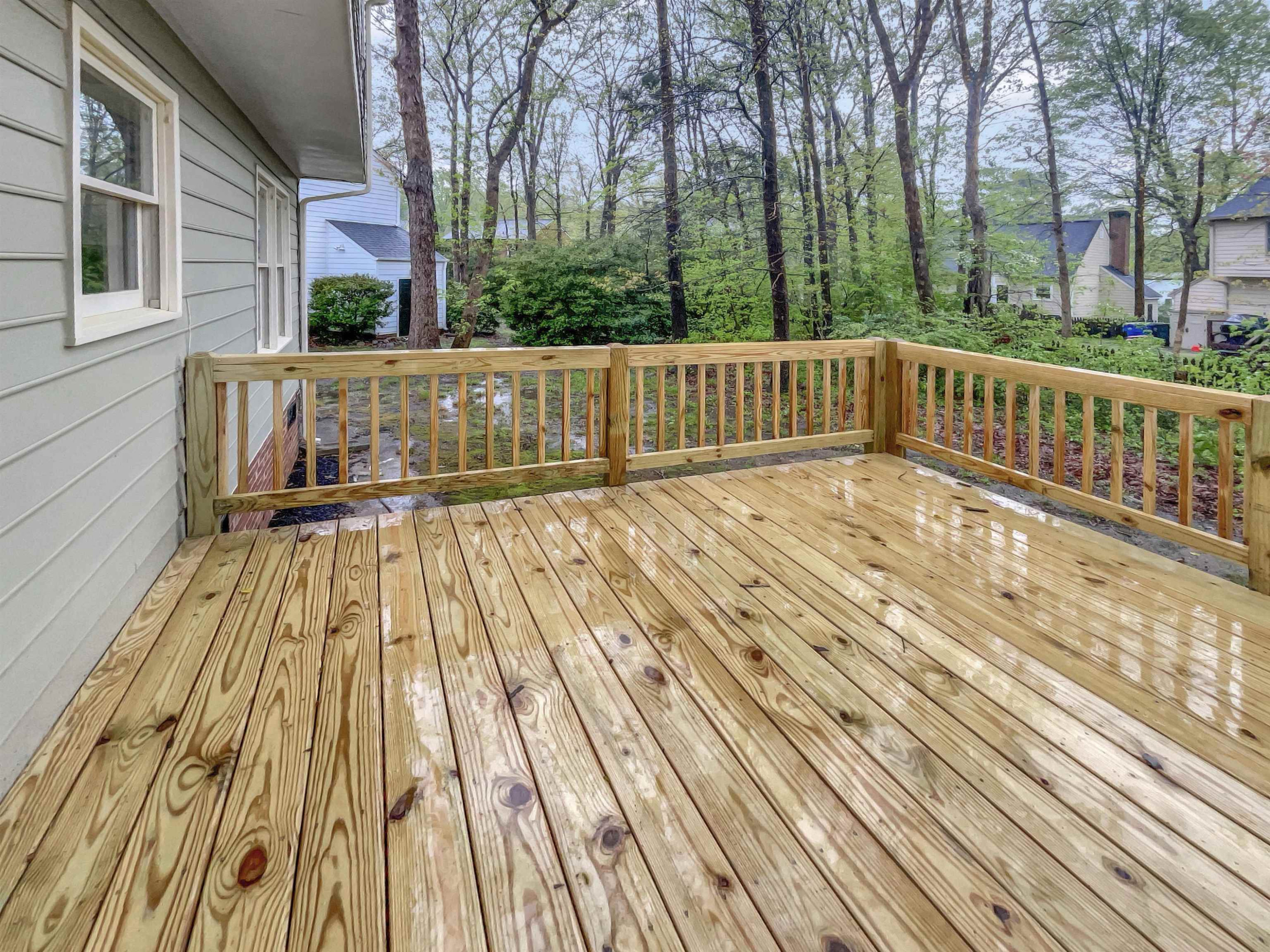 7320 Ewing Place Raleigh, NC 27616 - Photo 10 of 19 a view of wooden balcony with wooden floor and fence