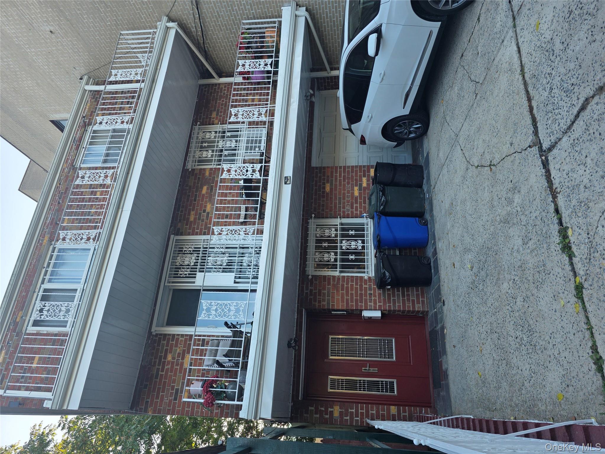 a front view of a house with barbeque area