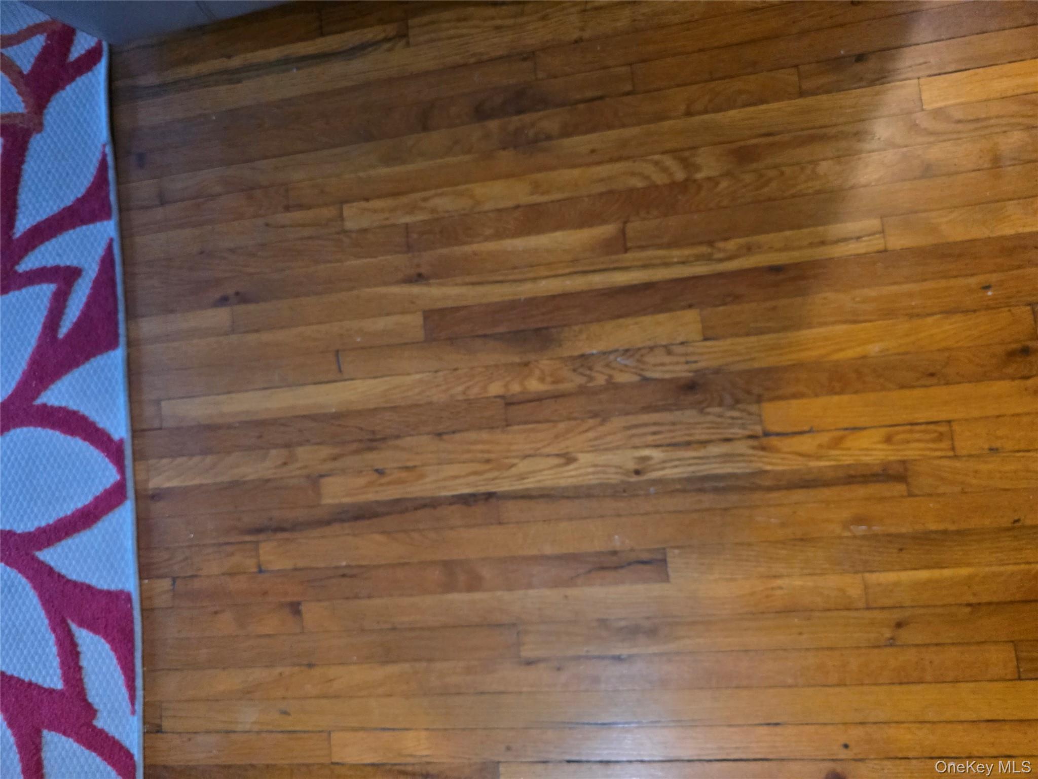 49-12 111th Street Queens, NY 11368 - Photo 8 of 9 a room with a wooden door and curtain