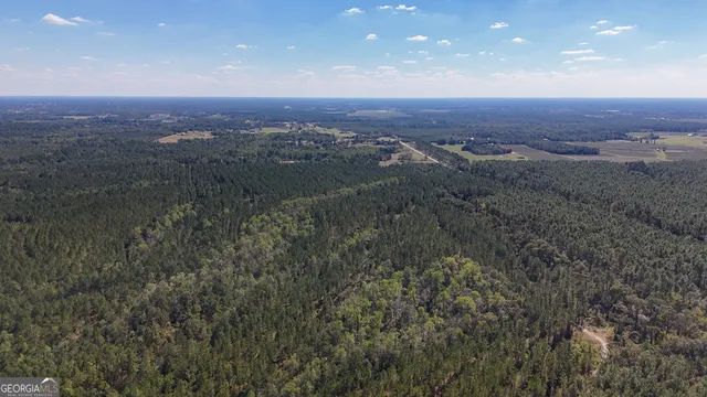 an aerial view of residential building and outdoor space