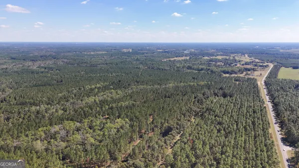 an aerial view of residential building and green space