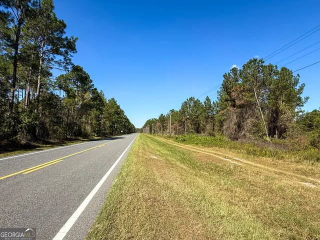 a view of swimming pool with a yard