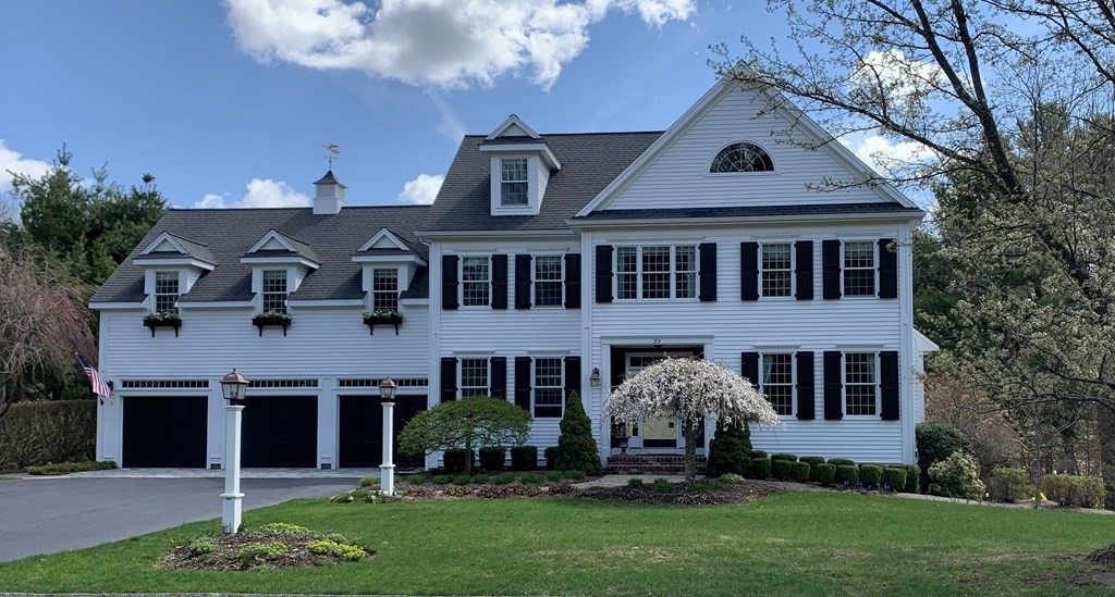 front view of a house with a yard