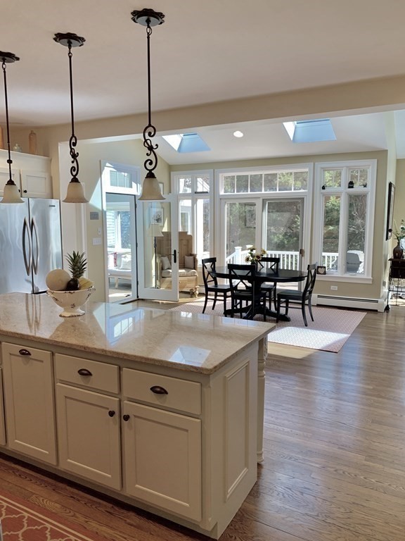 39 Vine Brook Road Medfield, MA 02052 - Photo 15 of 42 a kitchen with stainless steel appliances granite countertop a stove and living room view