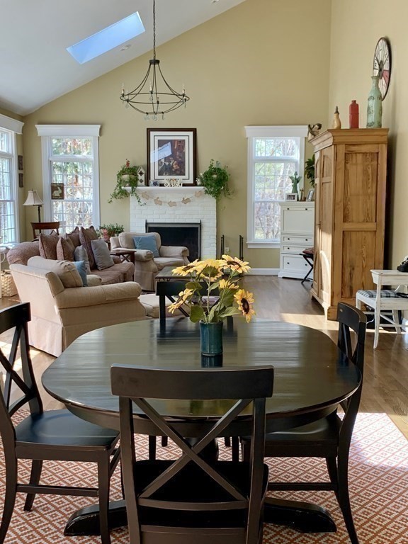 39 Vine Brook Road Medfield, MA 02052 - Photo 16 of 42 a view of a dining room with furniture and a fireplace