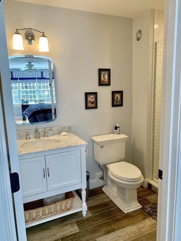 39 Vine Brook Road Medfield, MA 02052 - Photo 22 of 42 a bathroom with a sink toilet and vanity