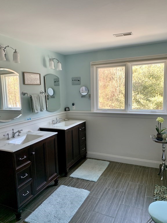 39 Vine Brook Road Medfield, MA 02052 - Photo 27 of 42 a bathroom with a sink and a mirror