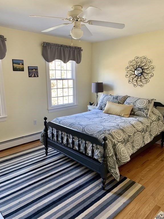 39 Vine Brook Road Medfield, MA 02052 - Photo 30 of 42 a bed sitting in a bedroom next to a window