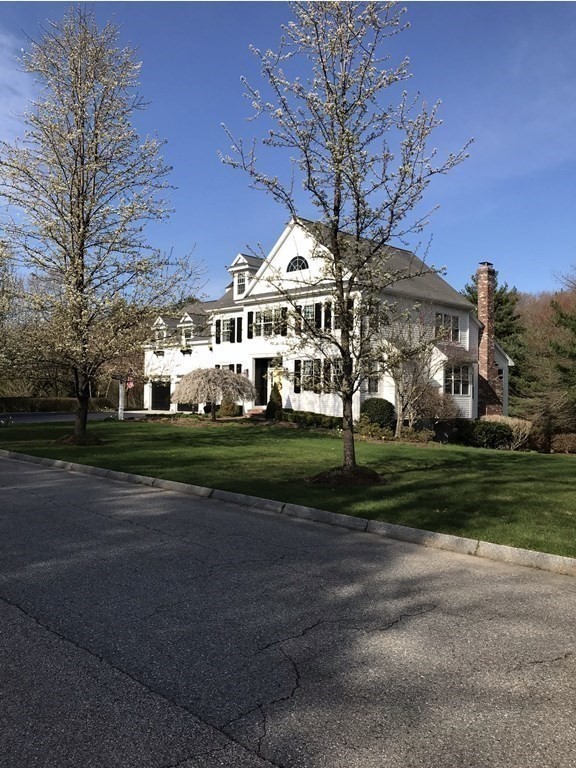 39 Vine Brook Road Medfield, MA 02052 - Photo 3 of 42 a view of a white house next to a yard with big trees
