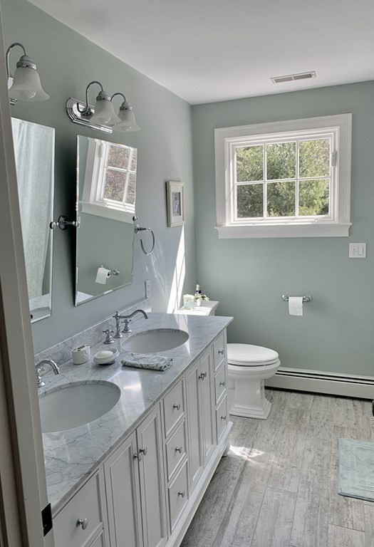 39 Vine Brook Road Medfield, MA 02052 - Photo 31 of 42 a bathroom with a granite countertop toilet sink and mirror