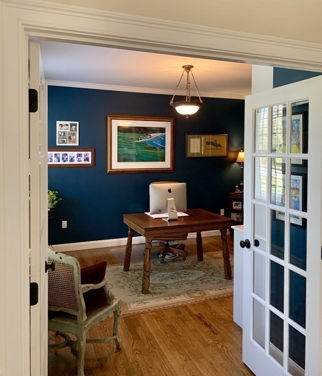 39 Vine Brook Road Medfield, MA 02052 - Photo 6 of 42 a living room with furniture a rug and a bookshelf