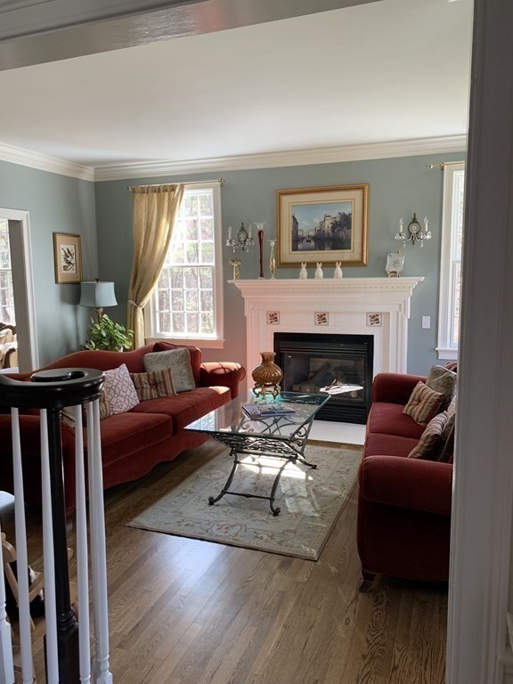 39 Vine Brook Road Medfield, MA 02052 - Photo 7 of 42 a living room with furniture and a fireplace