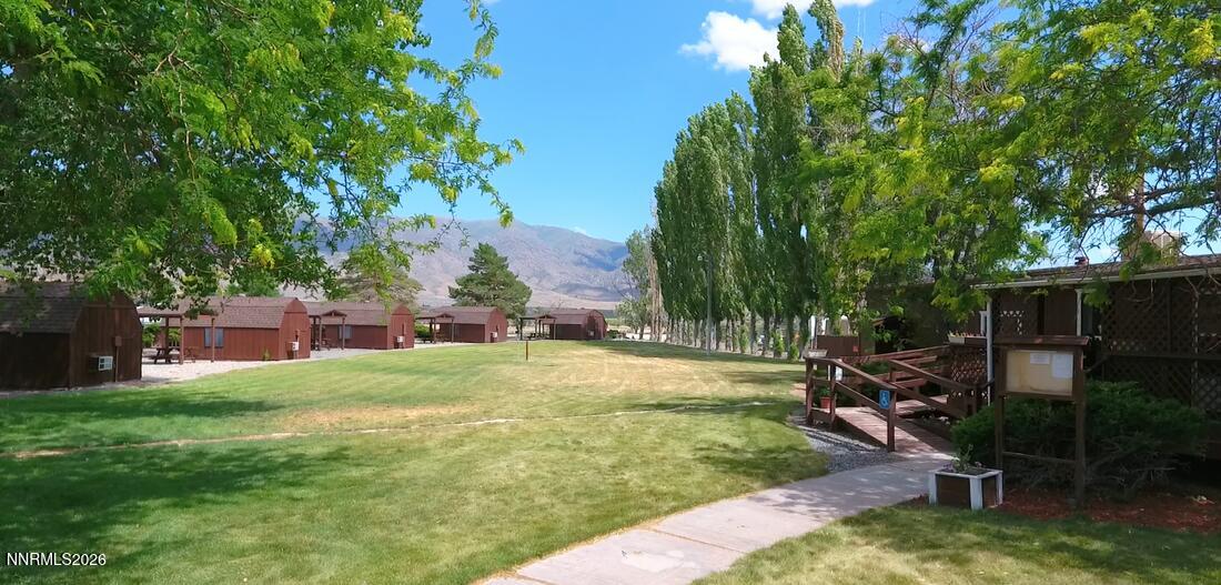 11385 Union Valley Road Lovelock, NV 89419 - Photo 16 of 17 a view of a backyard with table and chairs under an umbrella