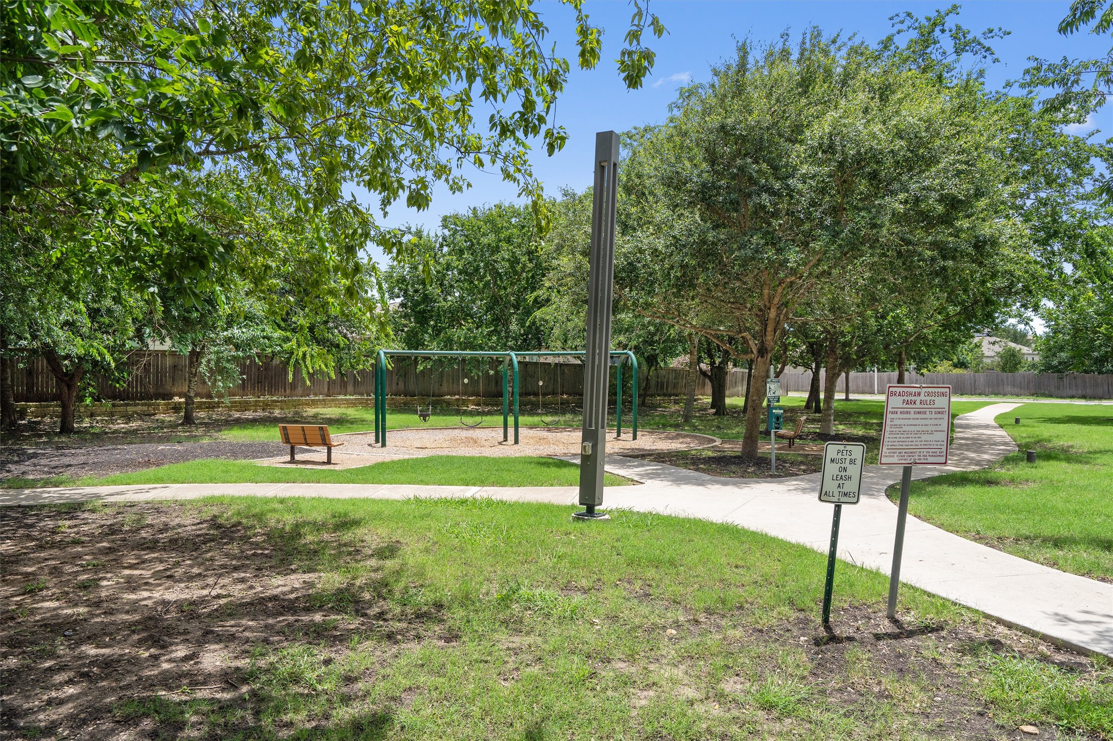 5825 Silver Screen Drive Austin, TX 78747 - Photo 36 of 40 A community park with winding pathways, ample shade, and playground equipment for recreation.