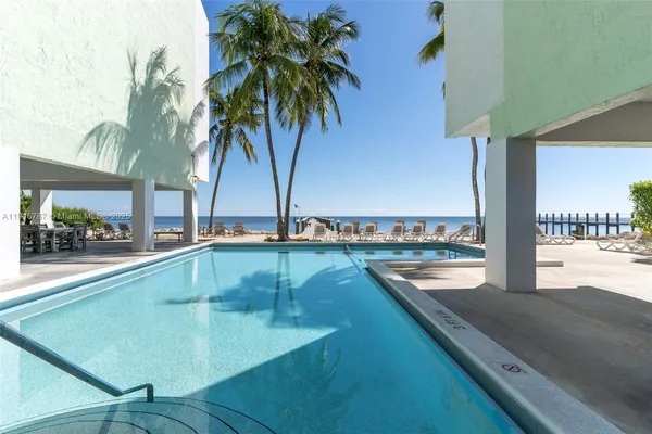 a view of a balcony with swimming pool