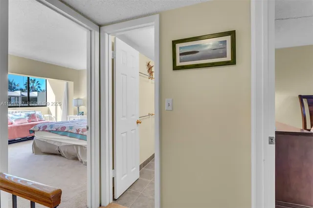 a bedroom with a bed and a table