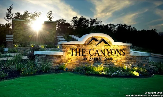 a view of swimming pool a garden and plants