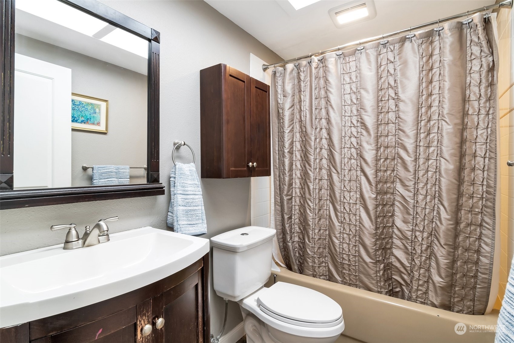 22205 5th Drive Southeast Bothell, WA 98021 - Photo 7 of 15 a bathroom with a sink a toilet and shower