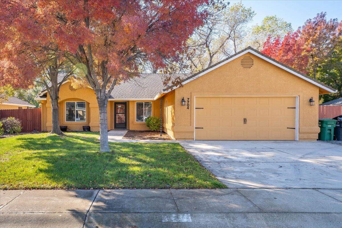 7704 Pit Road Redding, CA 96001 - Photo 1 of 34 a view of a house with yard and tree s
