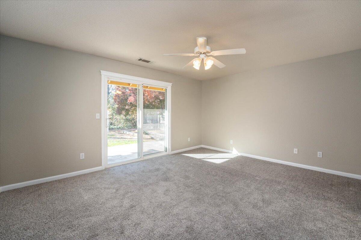 7704 Pit Road Redding, CA 96001 - Photo 14 of 34 a view of an empty room with a window