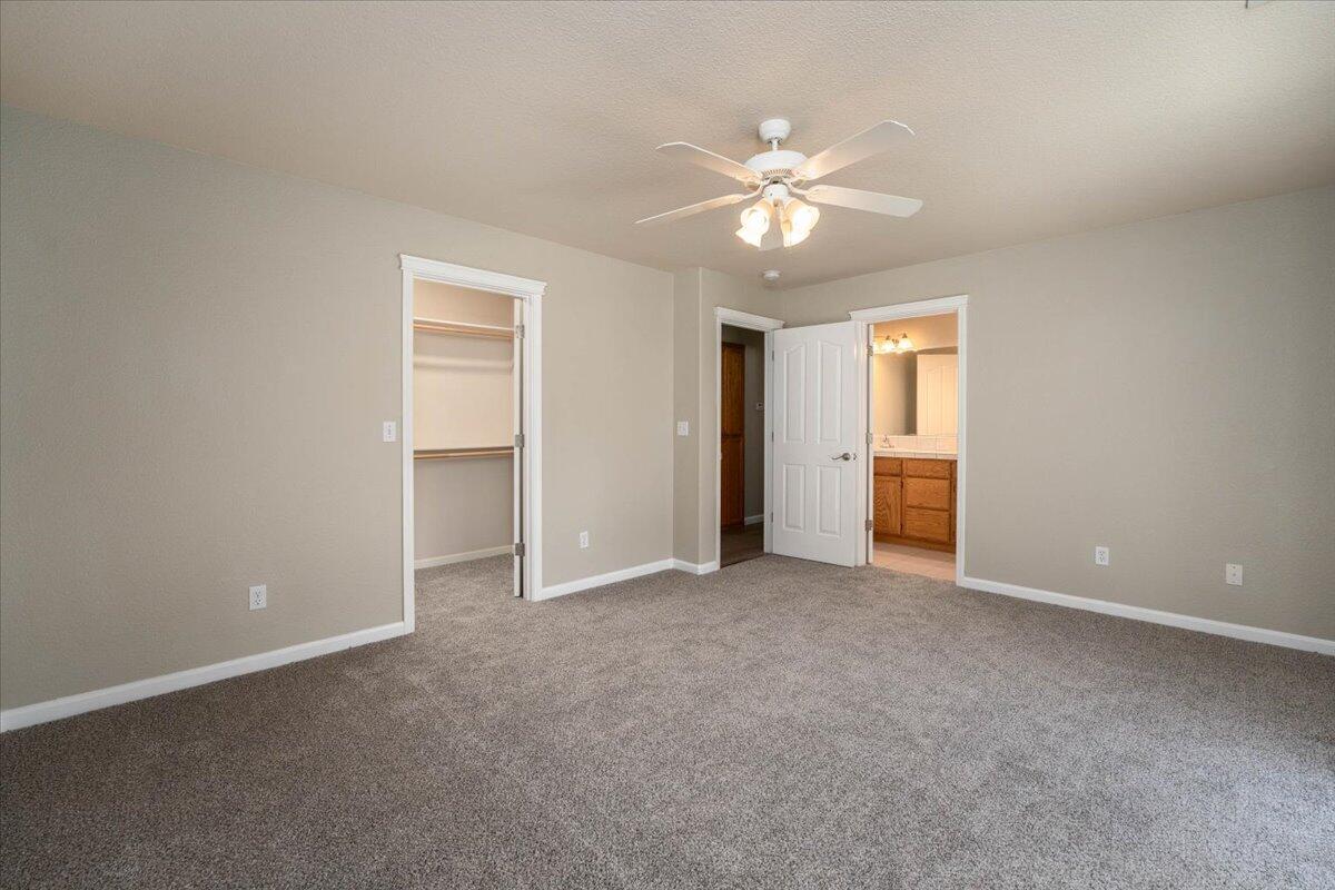7704 Pit Road Redding, CA 96001 - Photo 15 of 34 an empty room with closet and fan