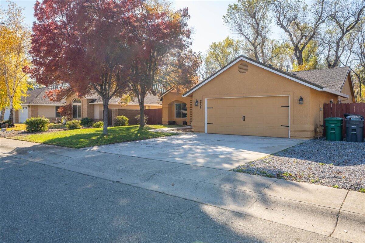 7704 Pit Road Redding, CA 96001 - Photo 2 of 34 a view of a house with a yard covered with snow in front of it