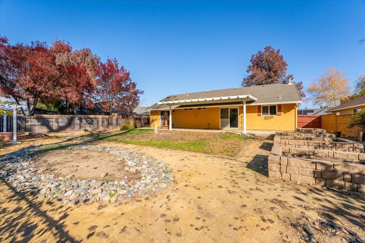 7704 Pit Road Redding, CA 96001 - Photo 30 of 34 a front view of a house with a yard