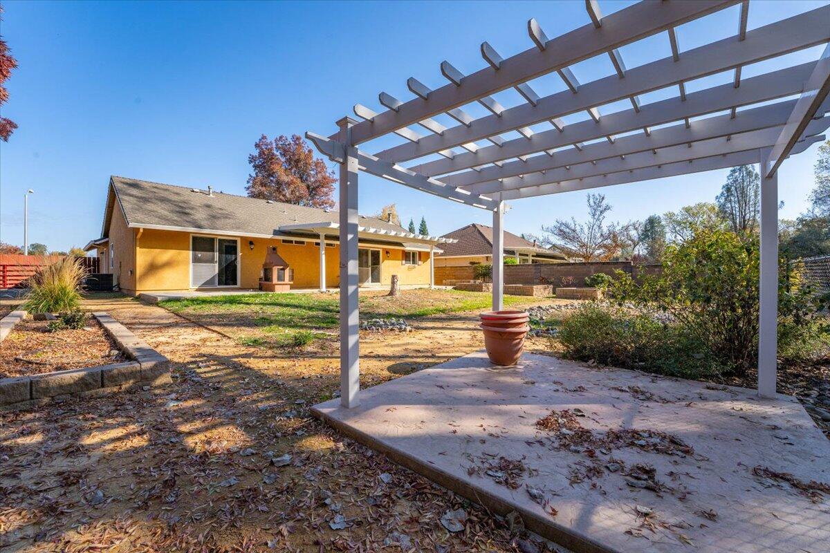 7704 Pit Road Redding, CA 96001 - Photo 31 of 34 a view of a house with backyard