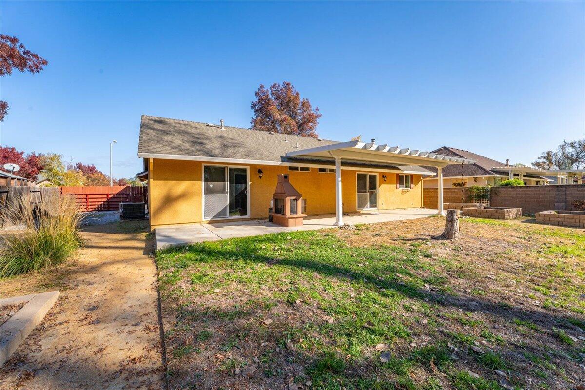 7704 Pit Road Redding, CA 96001 - Photo 33 of 34 a front view of a house with garden