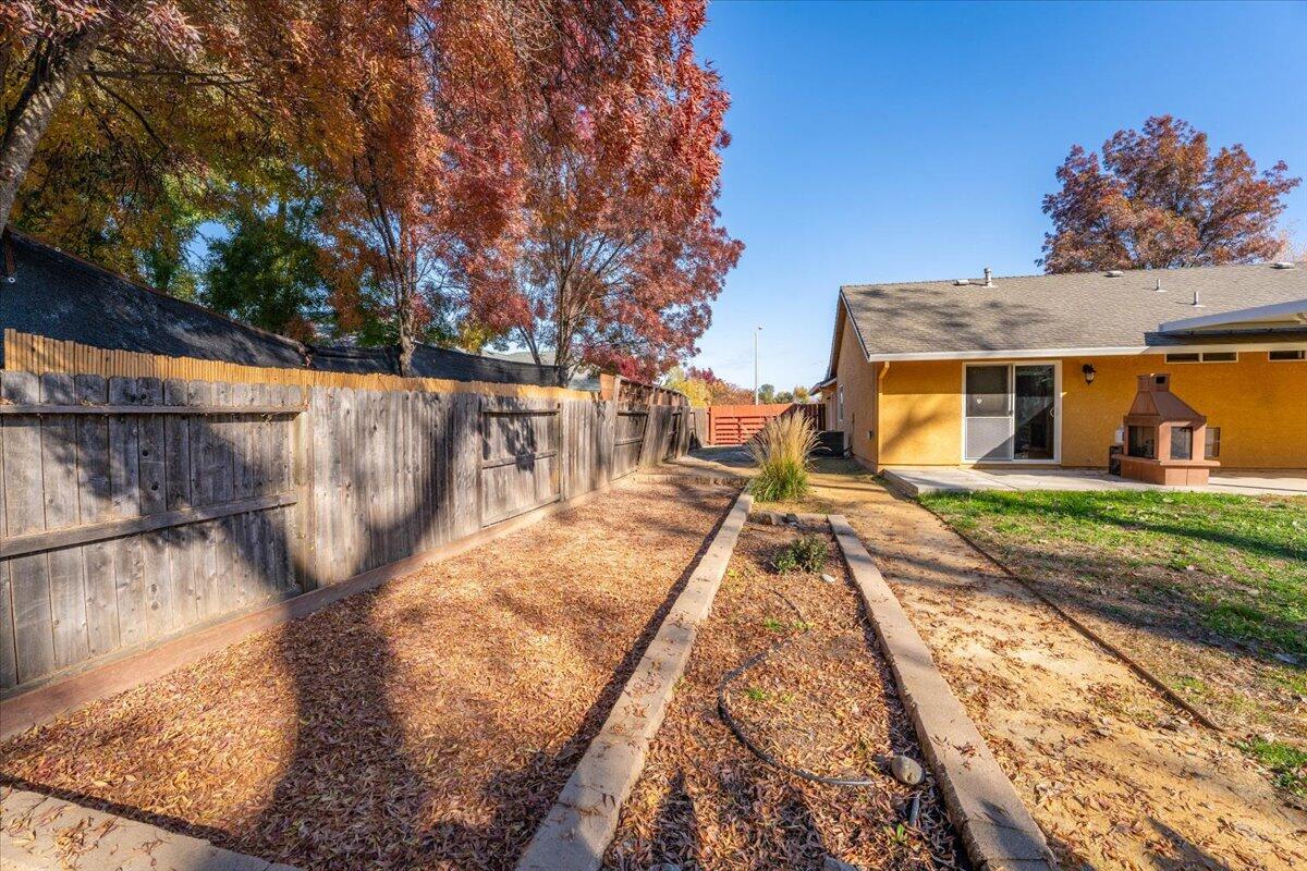 7704 Pit Road Redding, CA 96001 - Photo 34 of 34 a view of a house with backyard