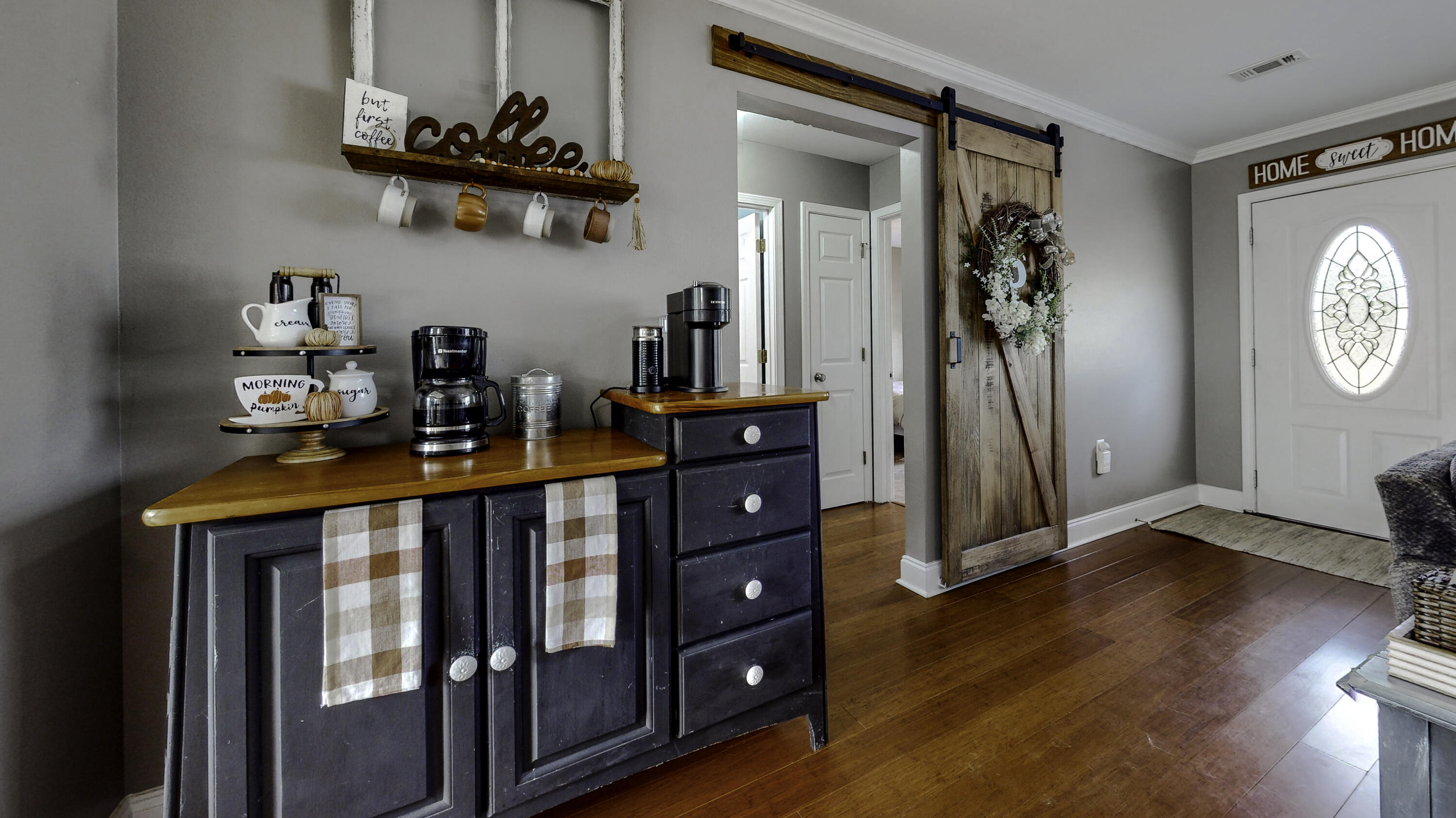 4696 Bobolink Way Crestview, FL 32539 - Photo 12 of 21 a front view of a house with entryway wooden floor and a window