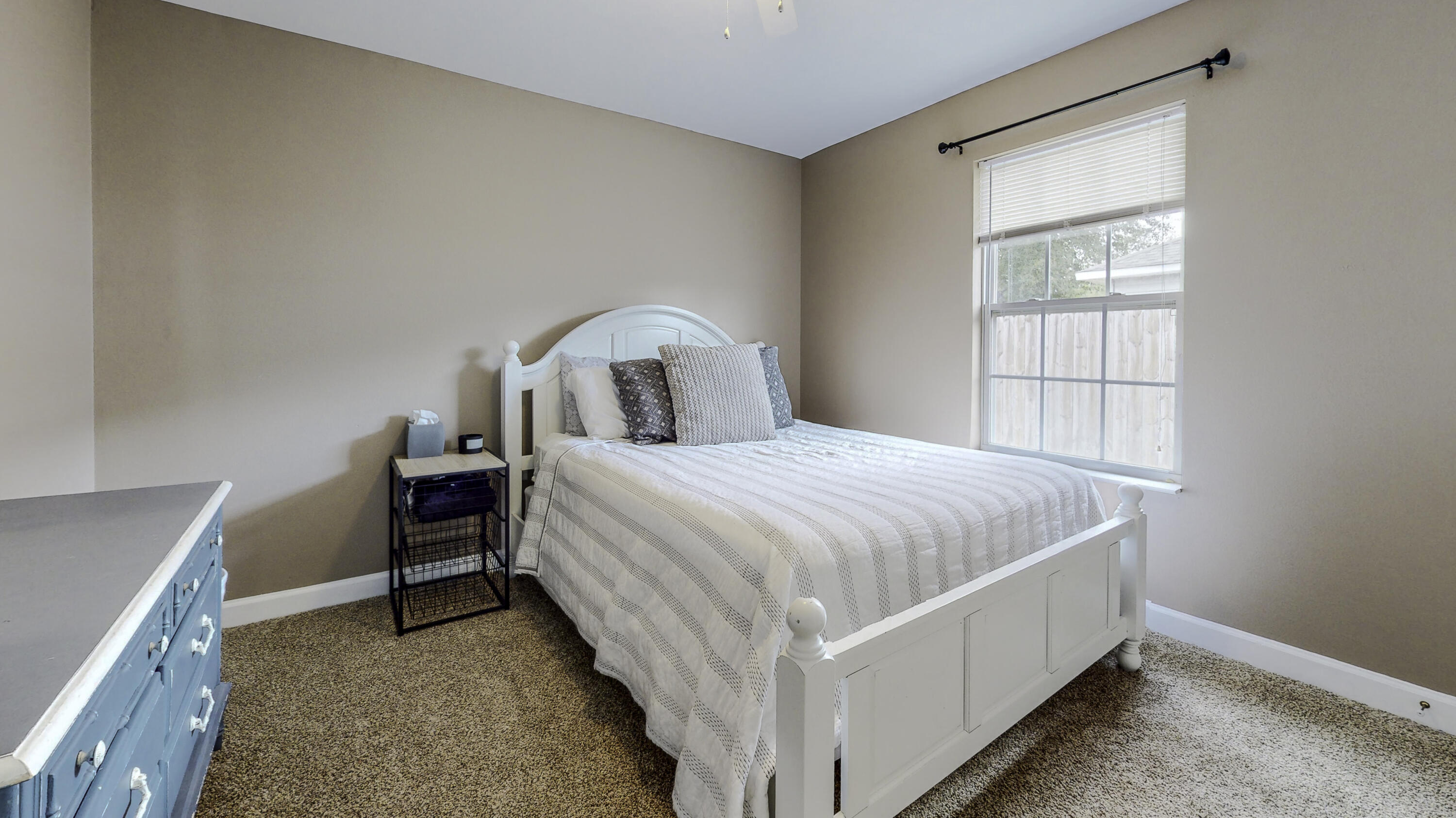 4696 Bobolink Way Crestview, FL 32539 - Photo 17 of 21 a bed room with a bed and a window