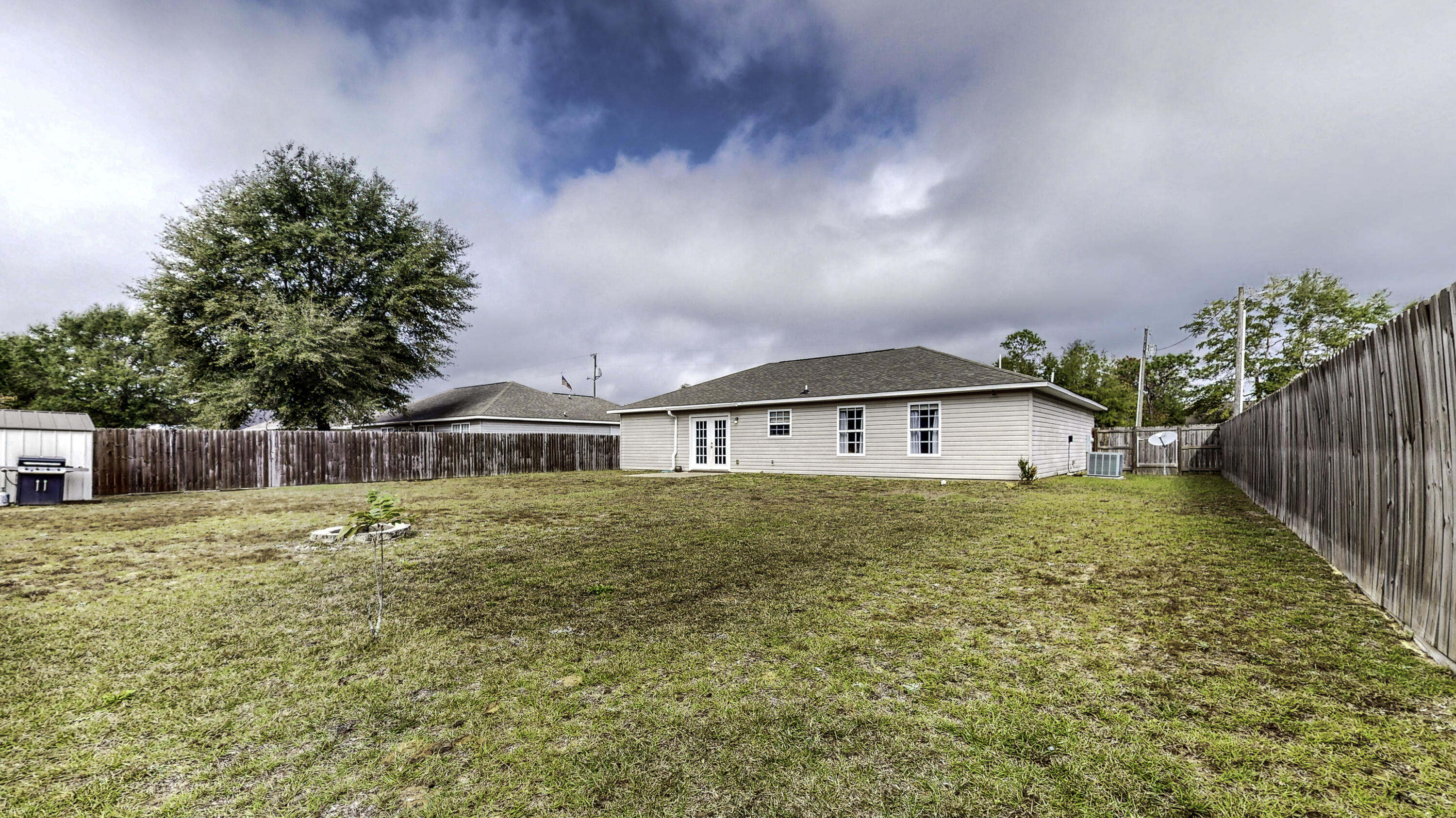4696 Bobolink Way Crestview, FL 32539 - Photo 20 of 21 a house view with a garden space