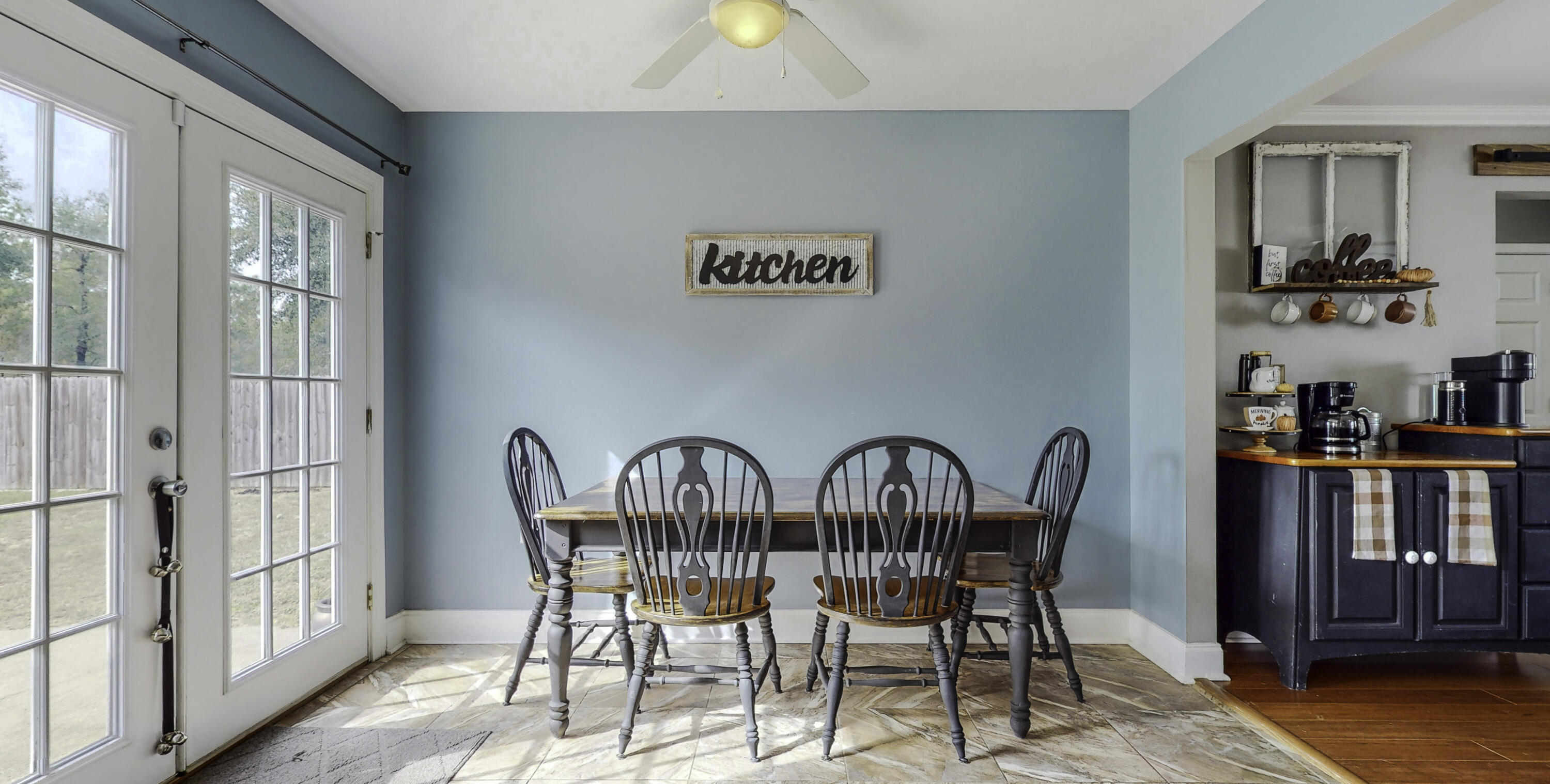 4696 Bobolink Way Crestview, FL 32539 - Photo 8 of 21 a view of a dining room with furniture window and wooden floor