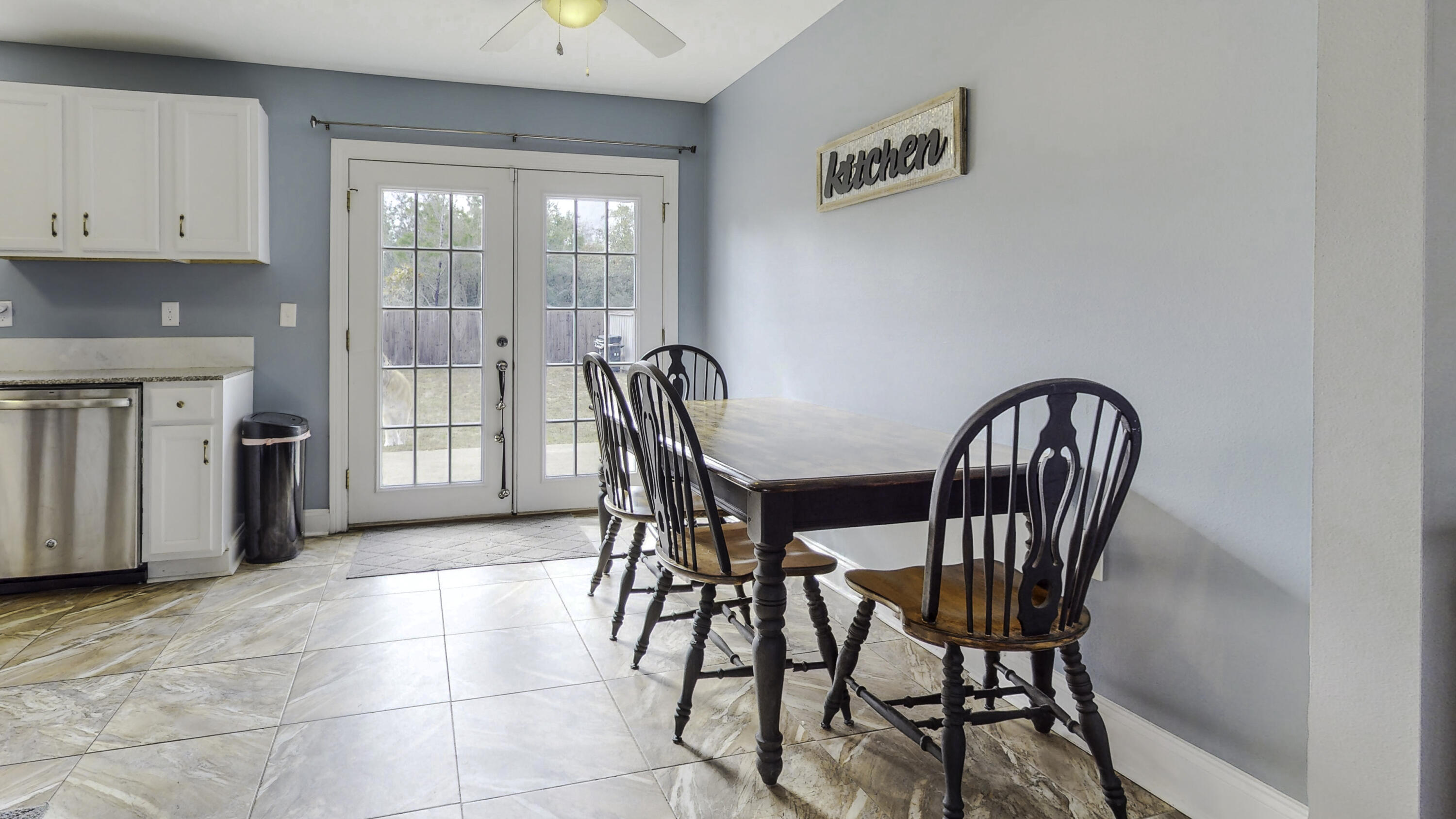 4696 Bobolink Way Crestview, FL 32539 - Photo 9 of 21 a view of a dining room with furniture and a window