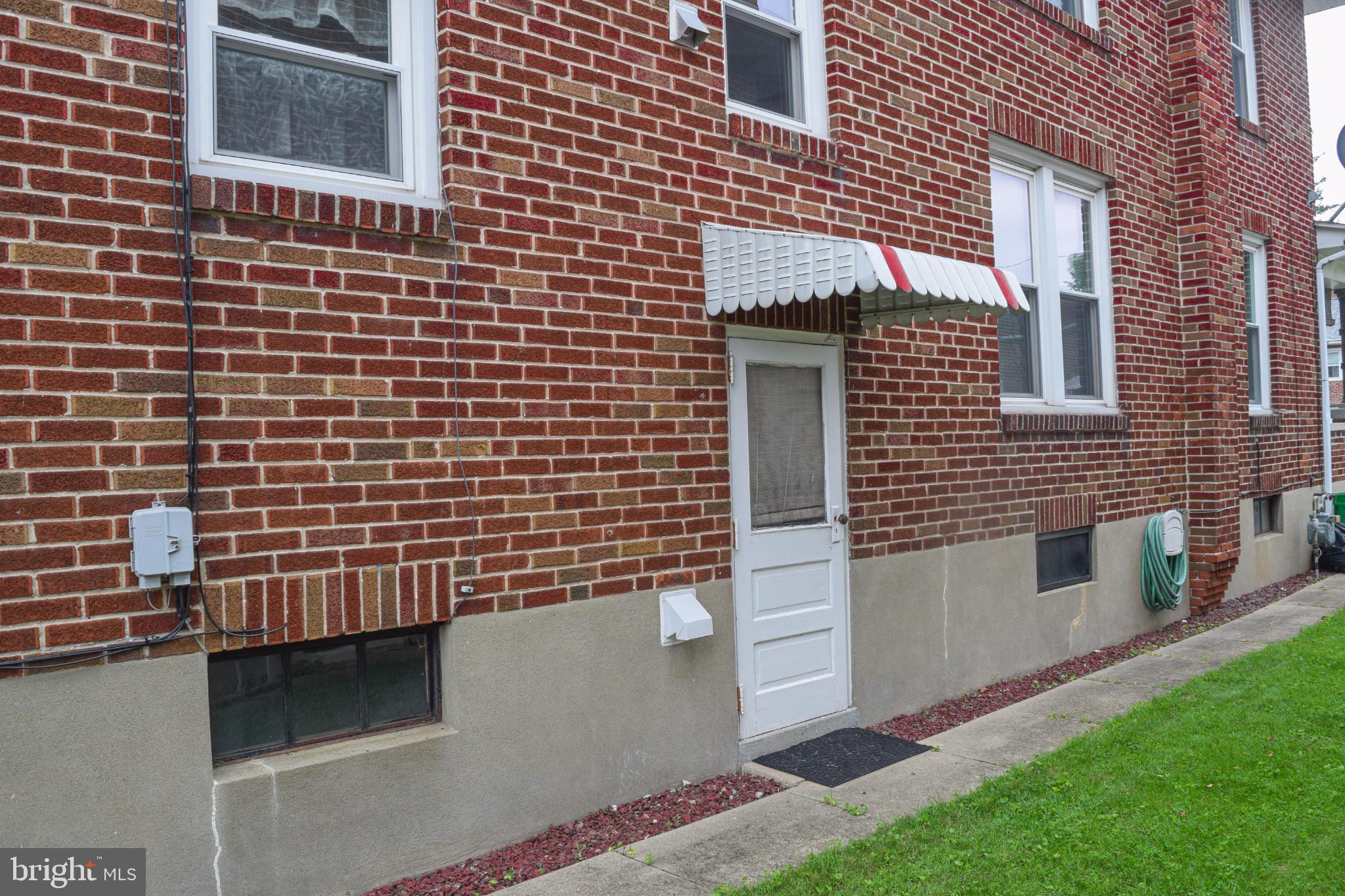 307 West Elm Street Reading, PA 19607 - Photo 8 of 26 Charming brick facade with inviting entrance.