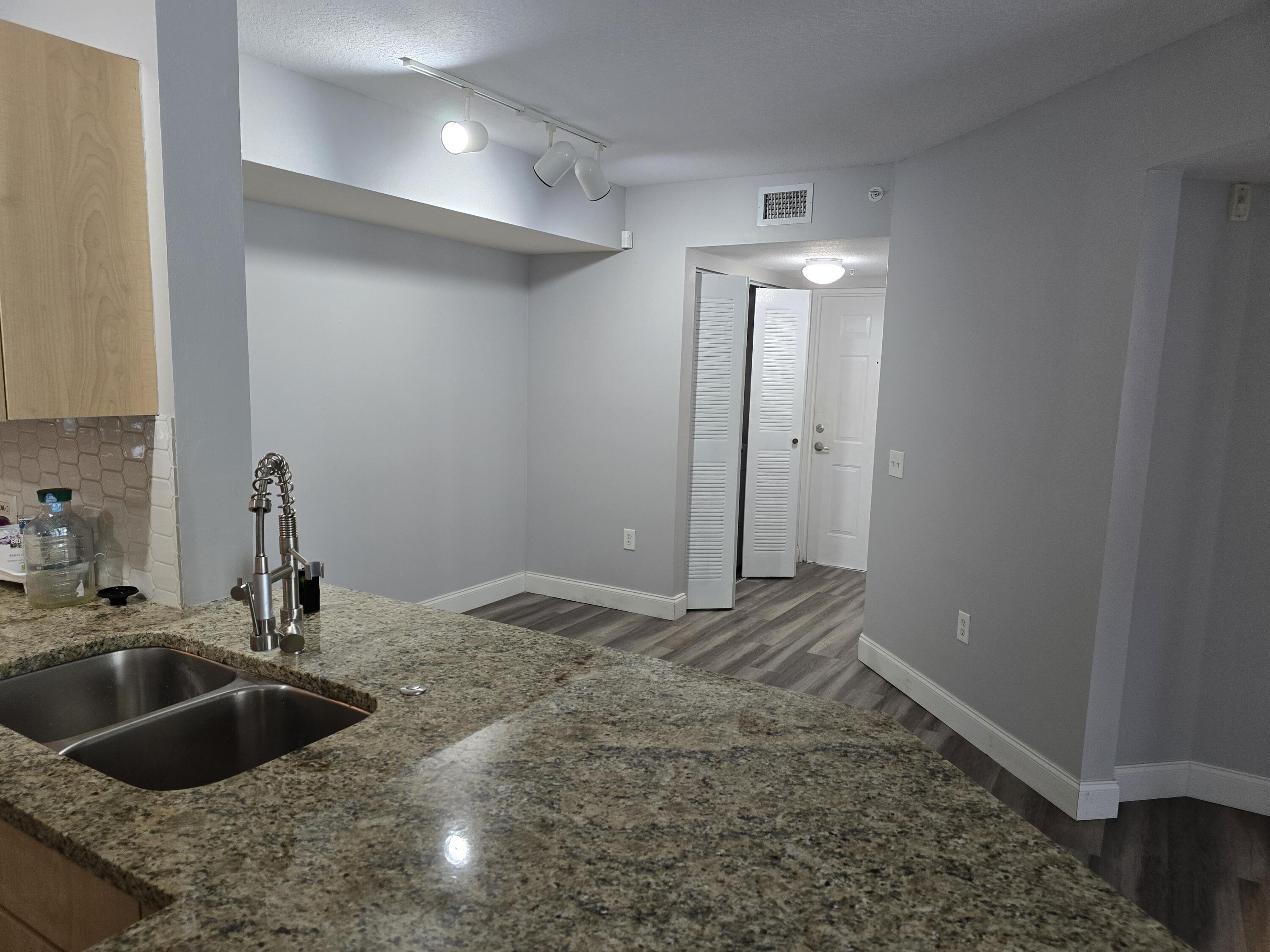 701 Villa Circle Boynton Beach, FL 33435 - Photo 2 of 17 a kitchen with a sink and a refrigerator